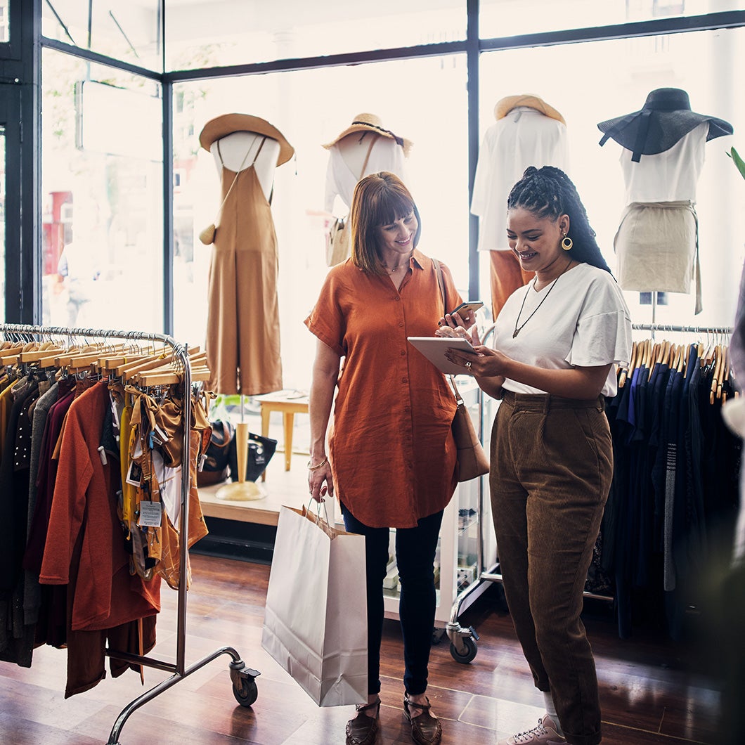 women with a tablet in a retail store