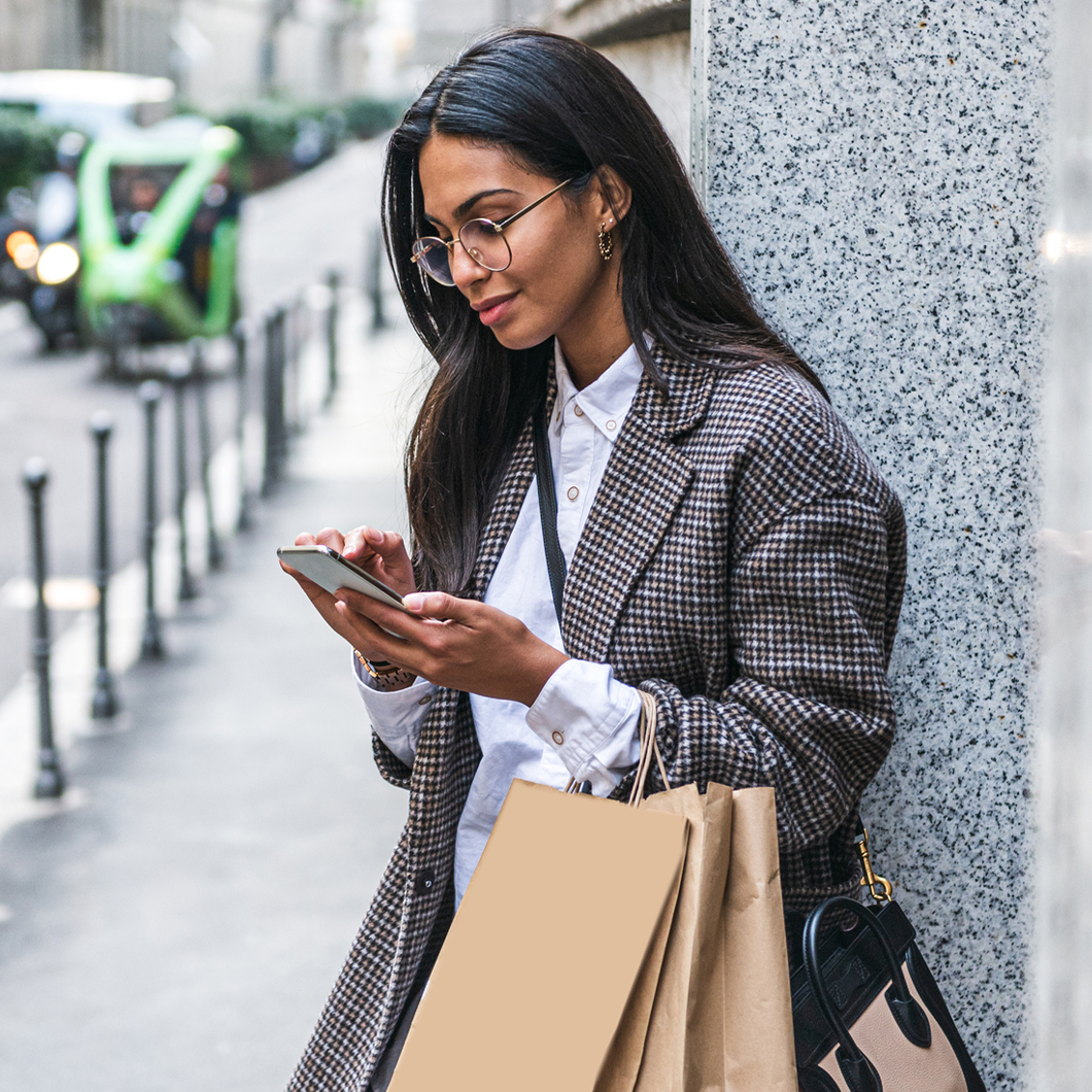 woman-phone-luxury-store-outside-abstract