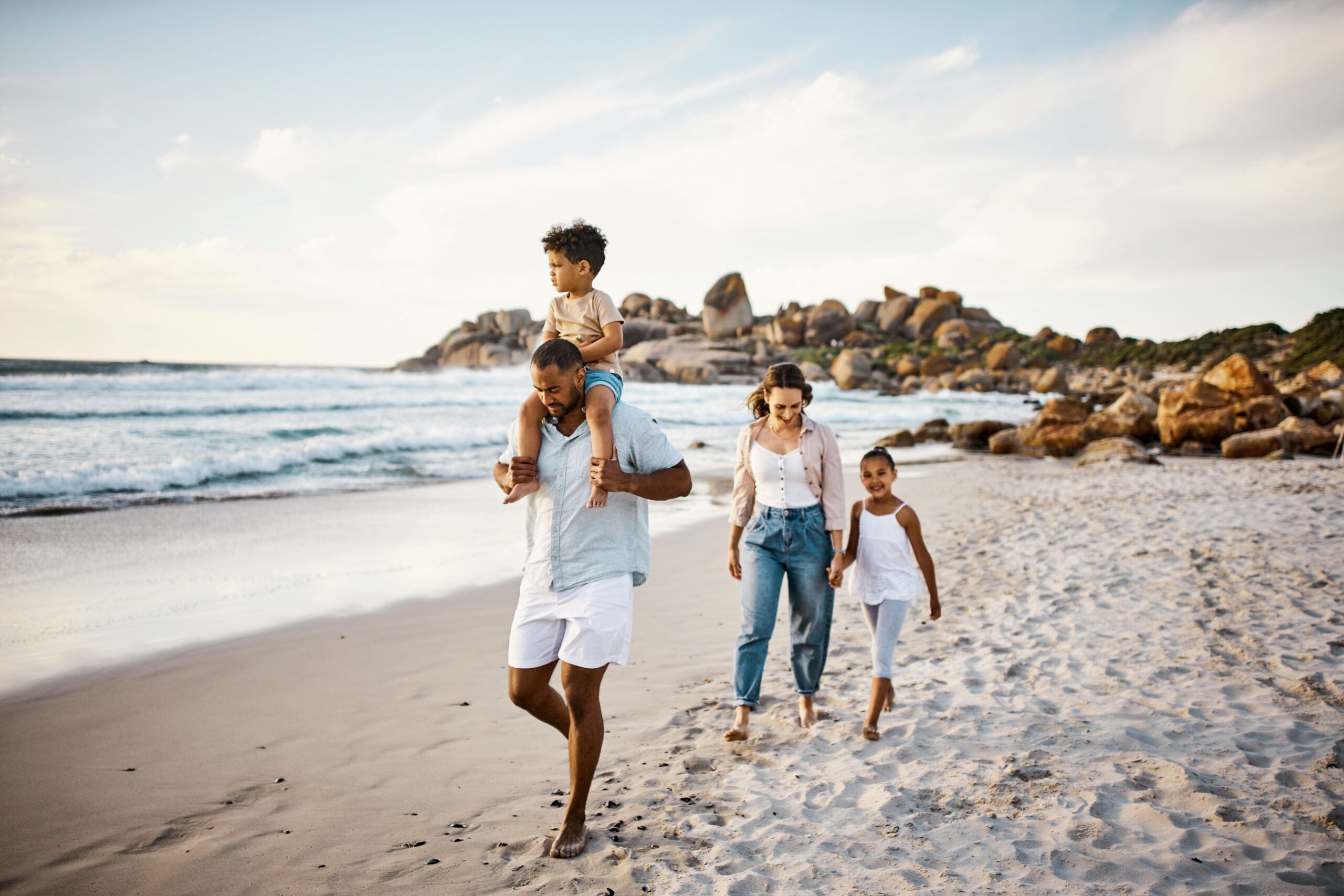 Family walking on beach