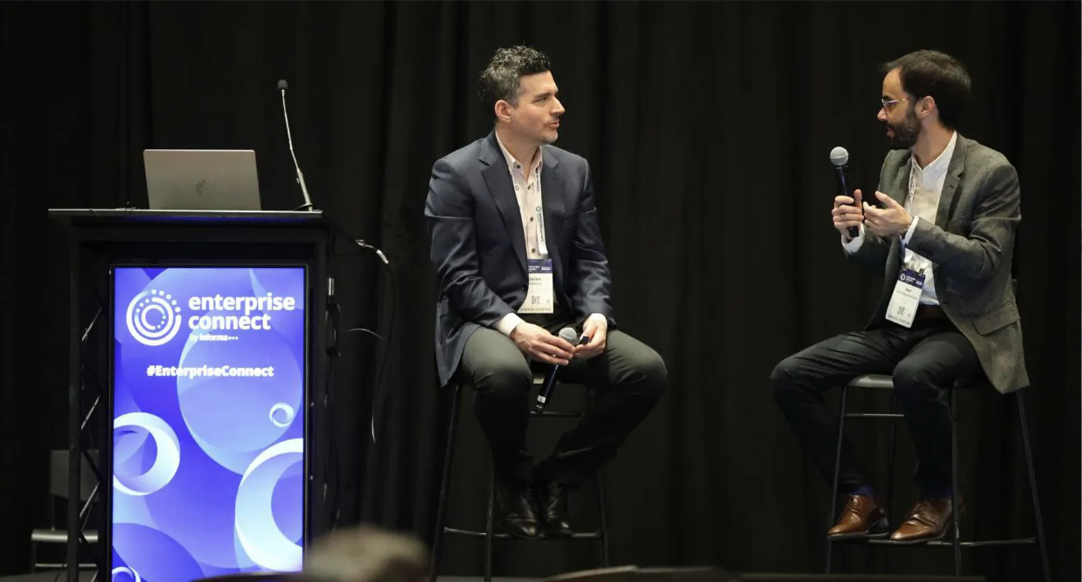 Verint’s Jason Valdina (left) speaks with Iker Urionaguena Oraa, Senior Manager of Customer Care for Volaris at Enterprise Connect