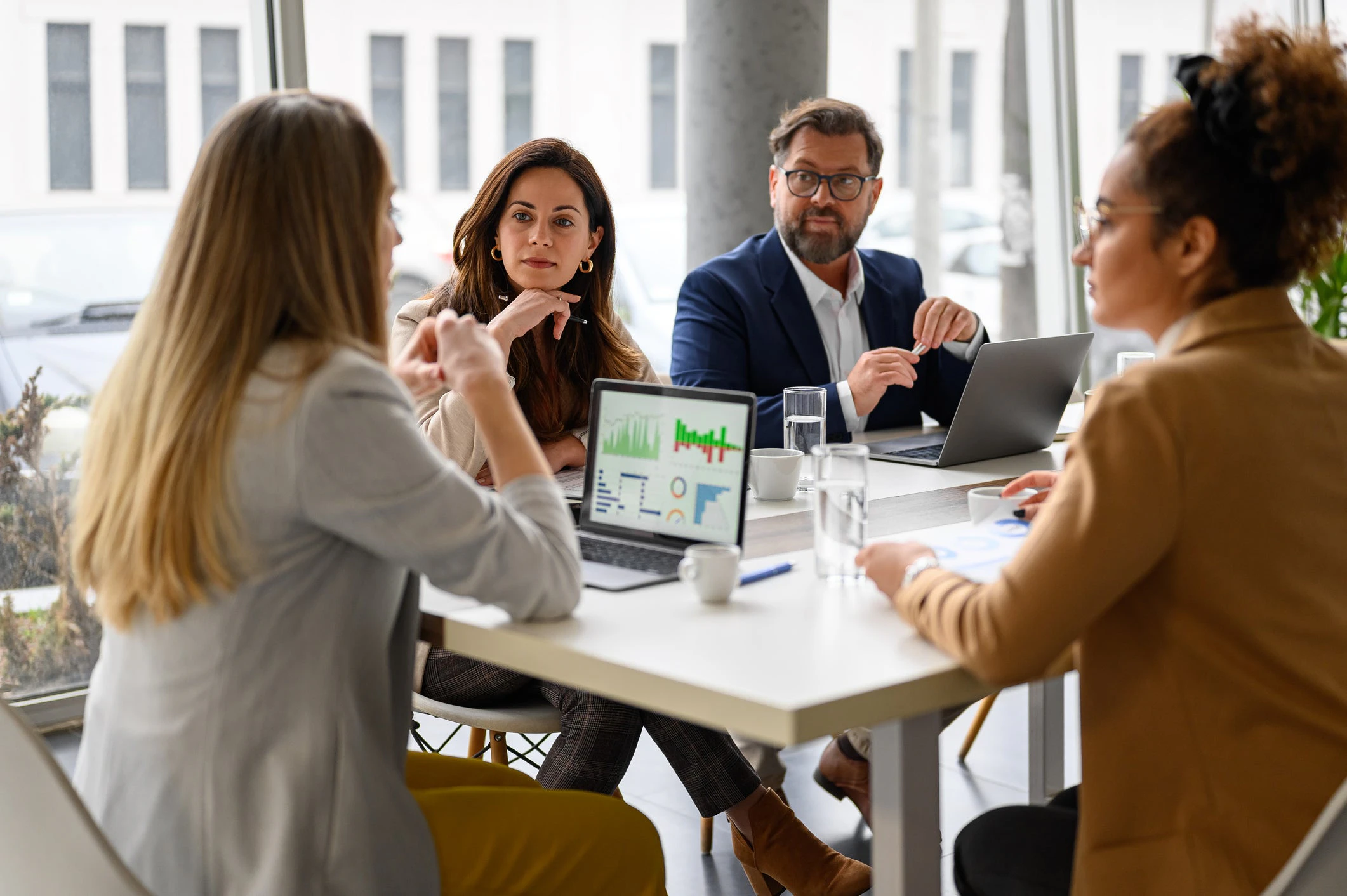 Quality analyst reviewing automated QA scores in a contact center