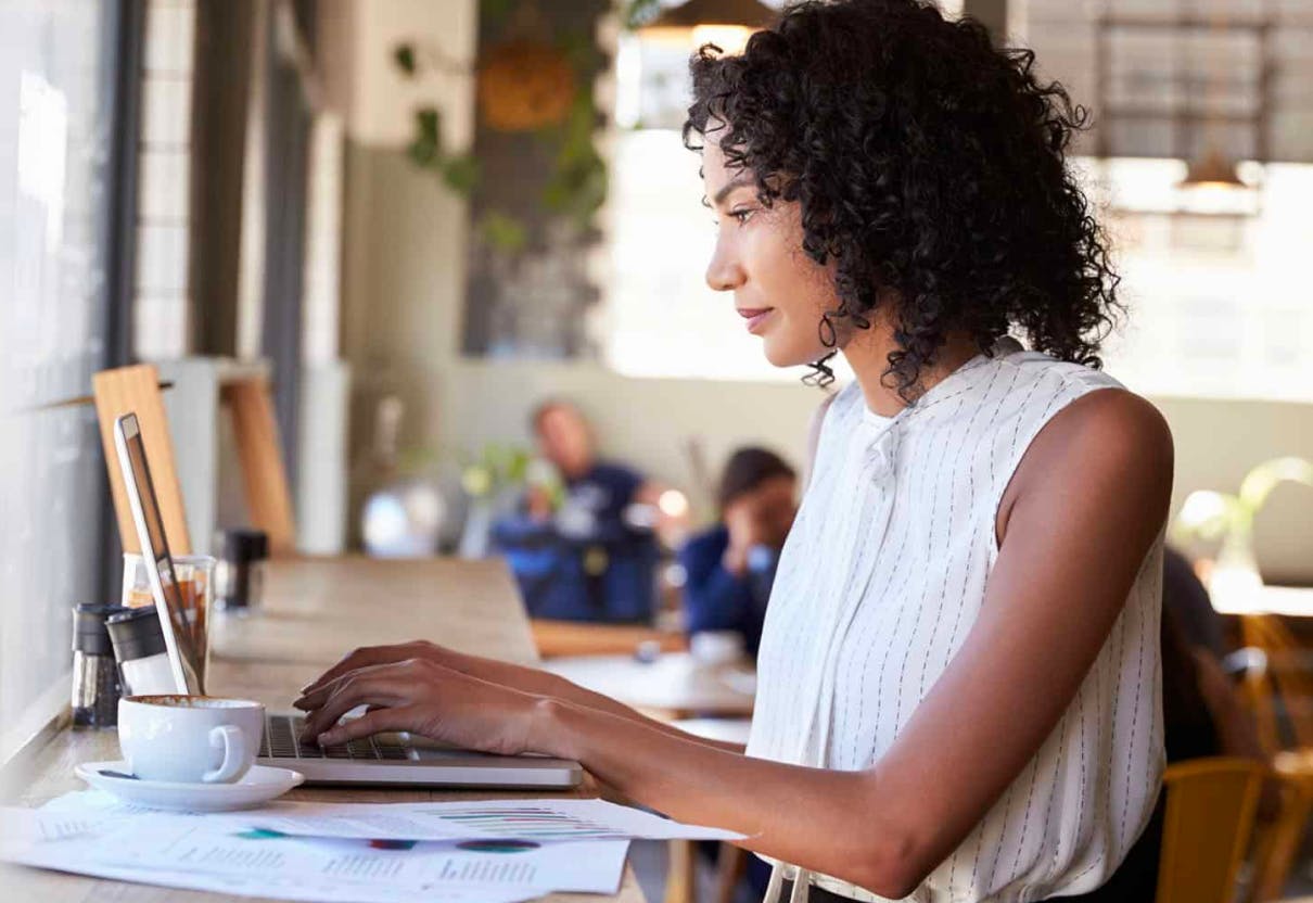 Woman in office working on laptop