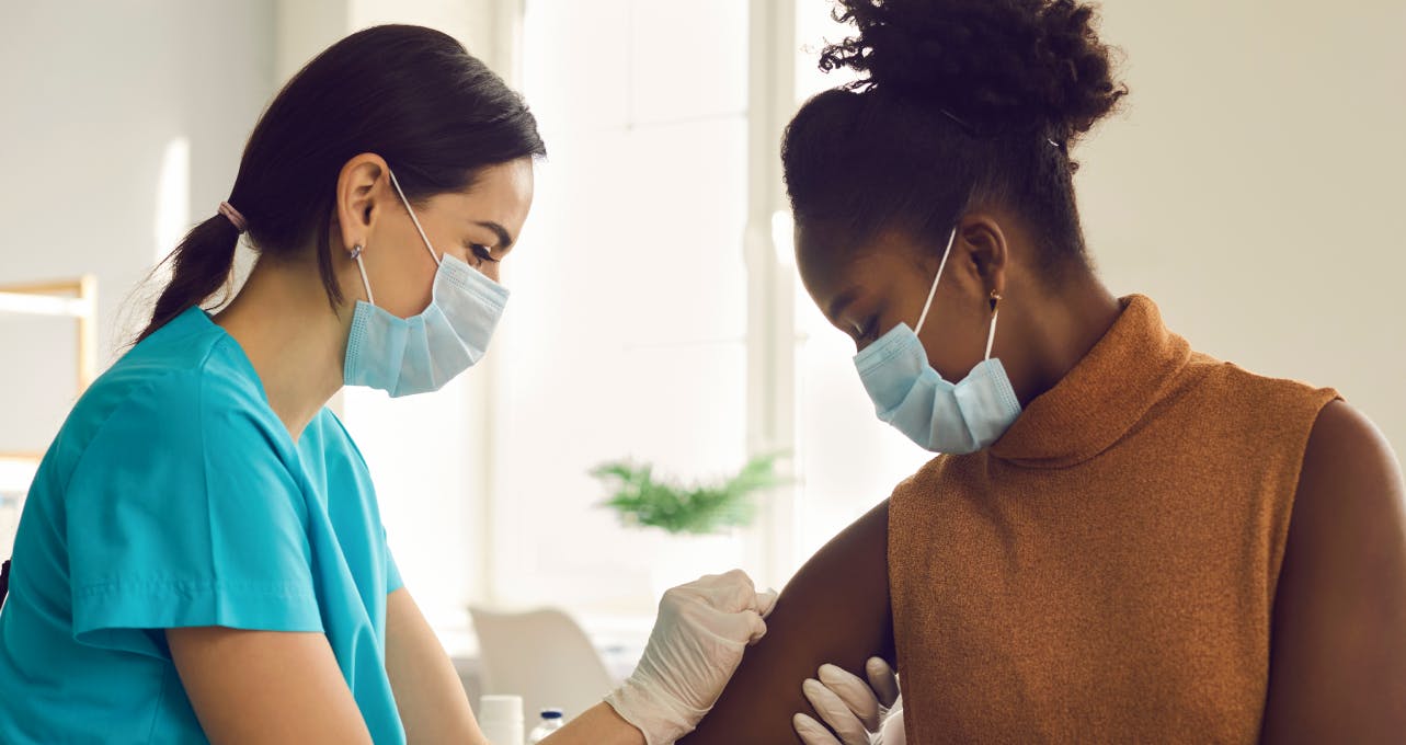 Woman getting a flu jab