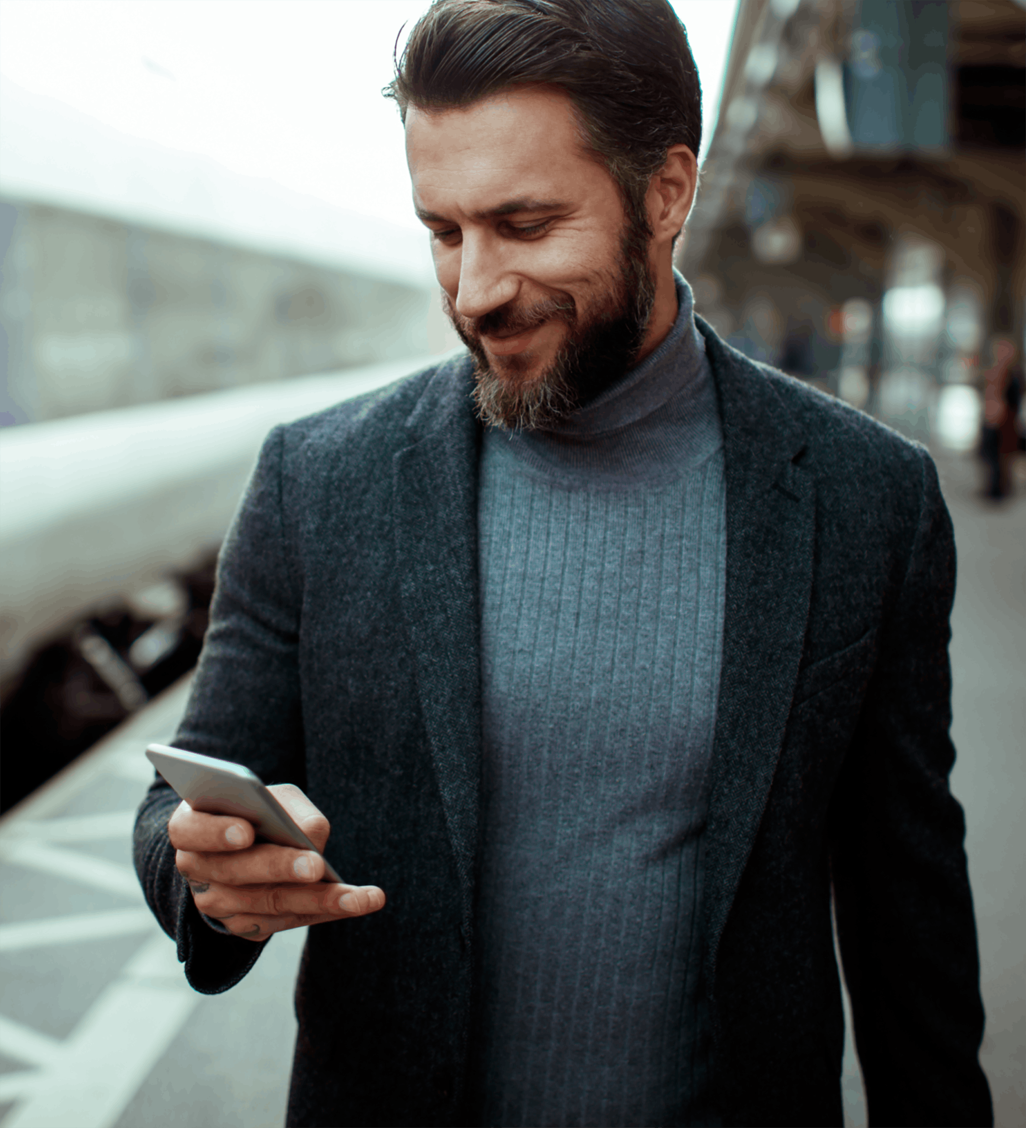 Man walking and texting outside on phone