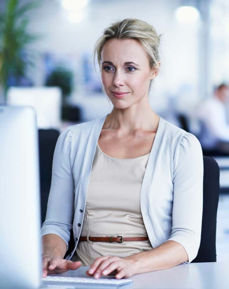 Woman working at her computer in office