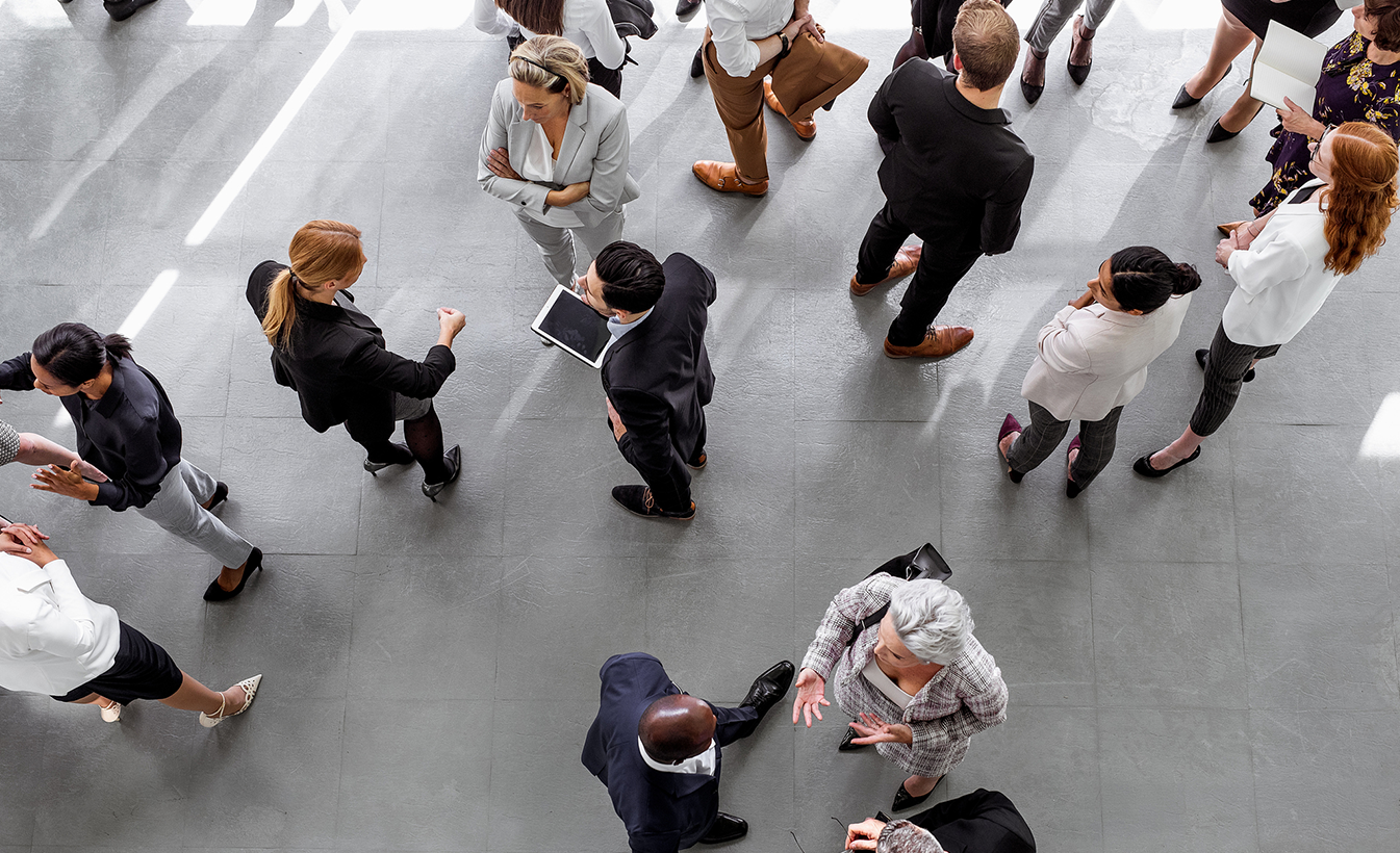 Crowd of business people talking a conference