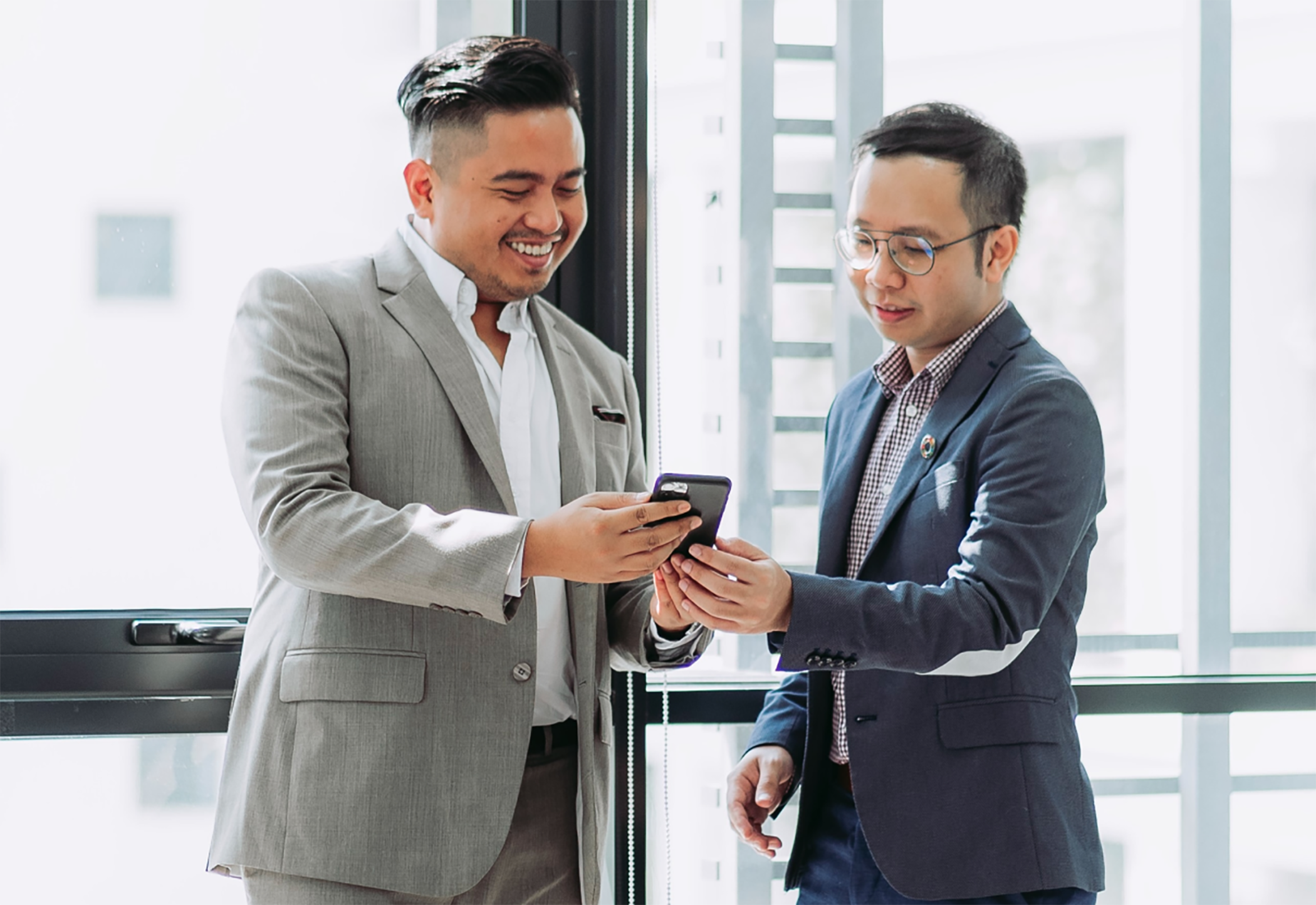 Two men meeting at phone