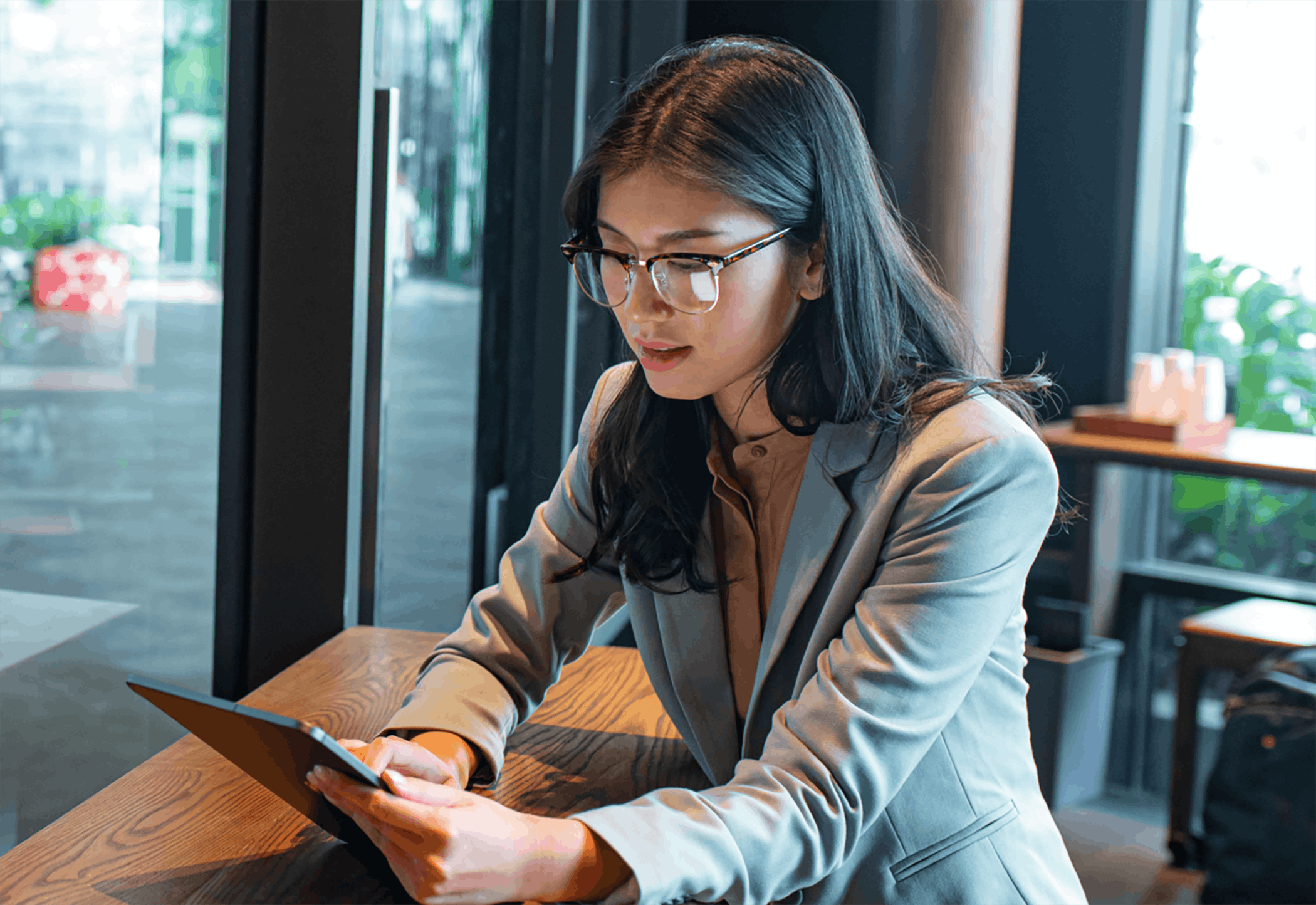 Woman sitting using tablet