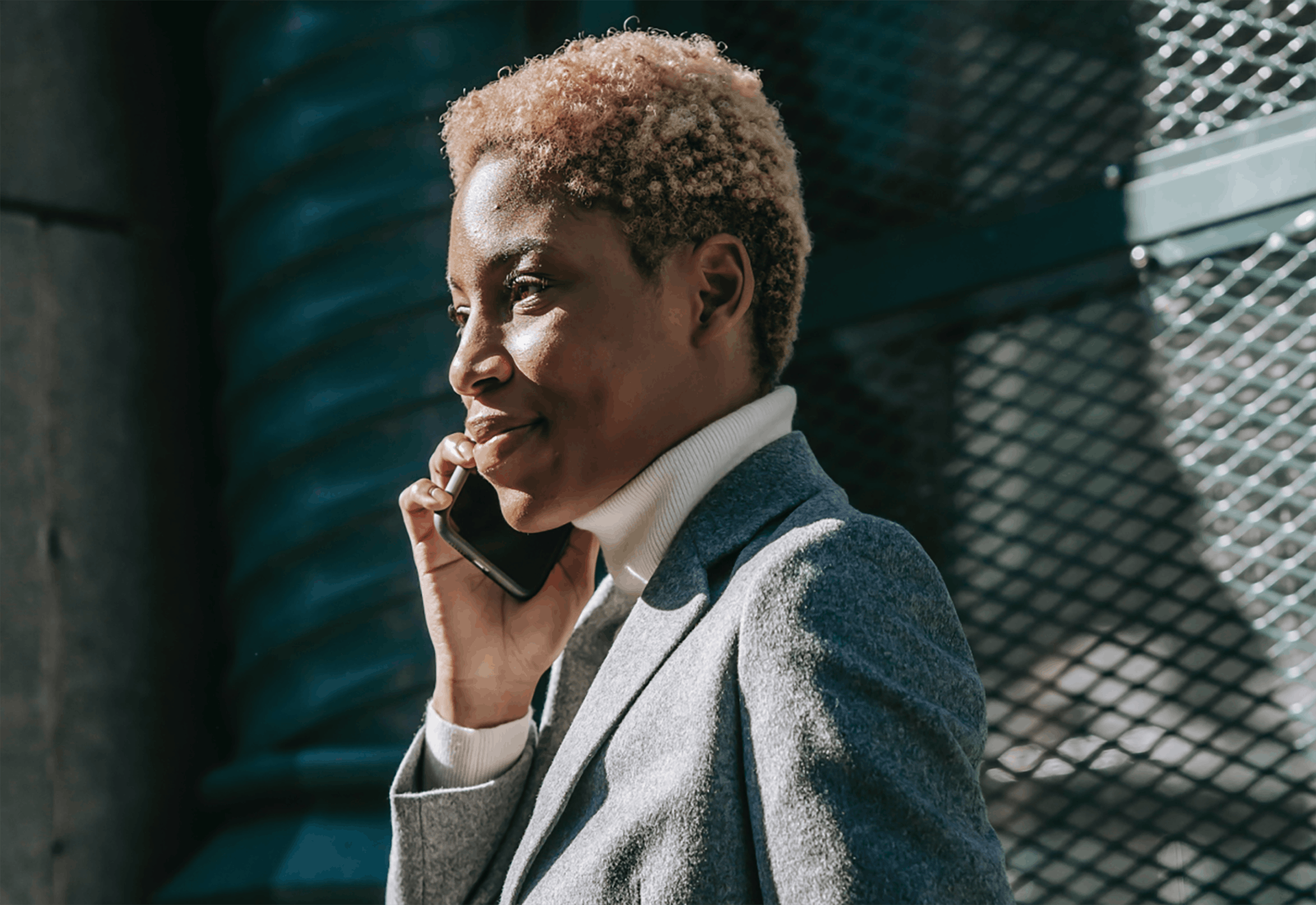 Woman talking on phone outside standing