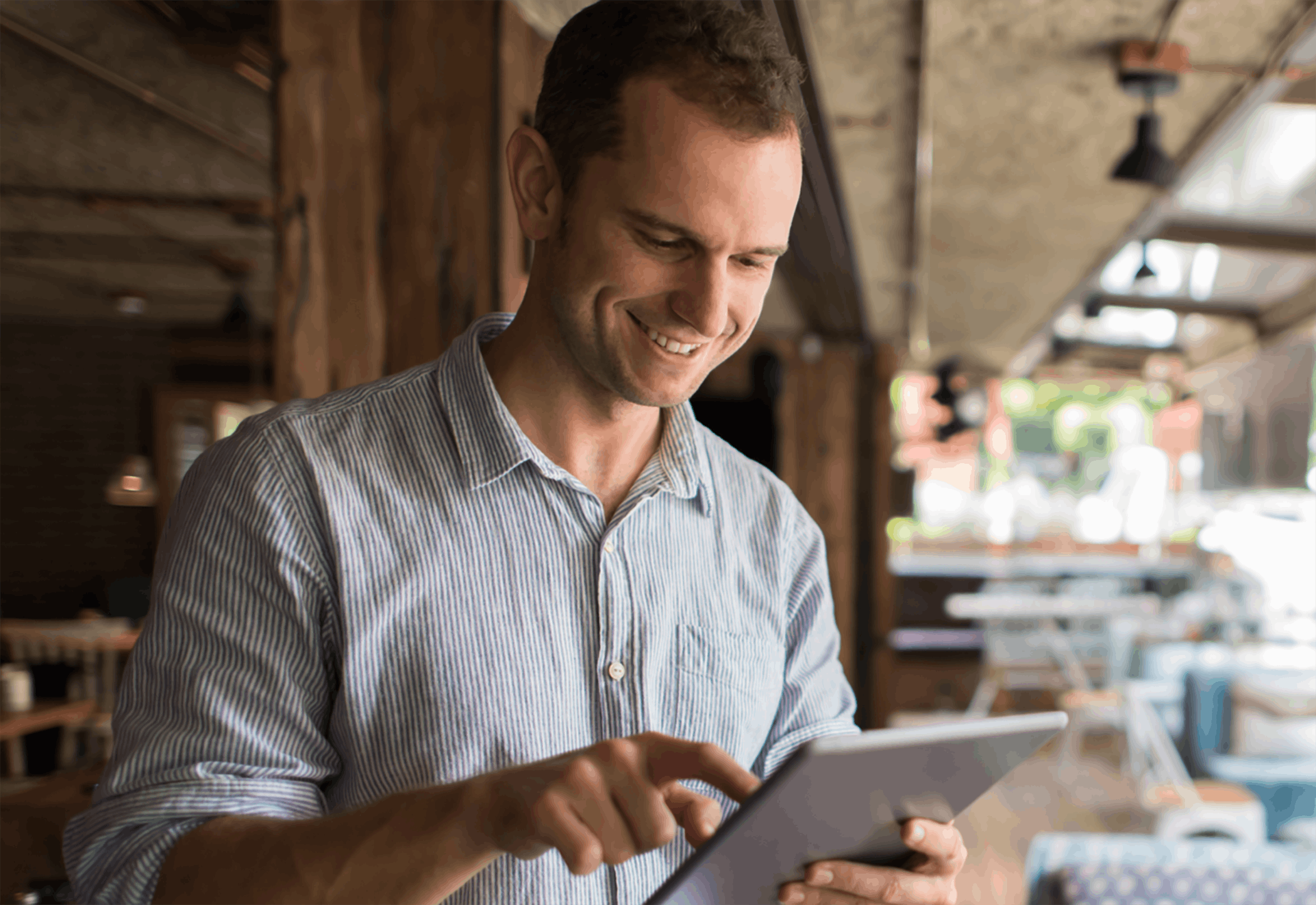 Man standing while using tablet