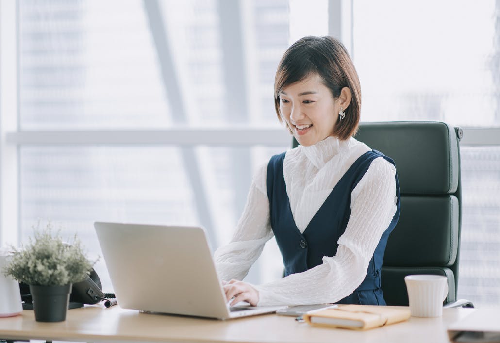 feature woman working on laptop highrise