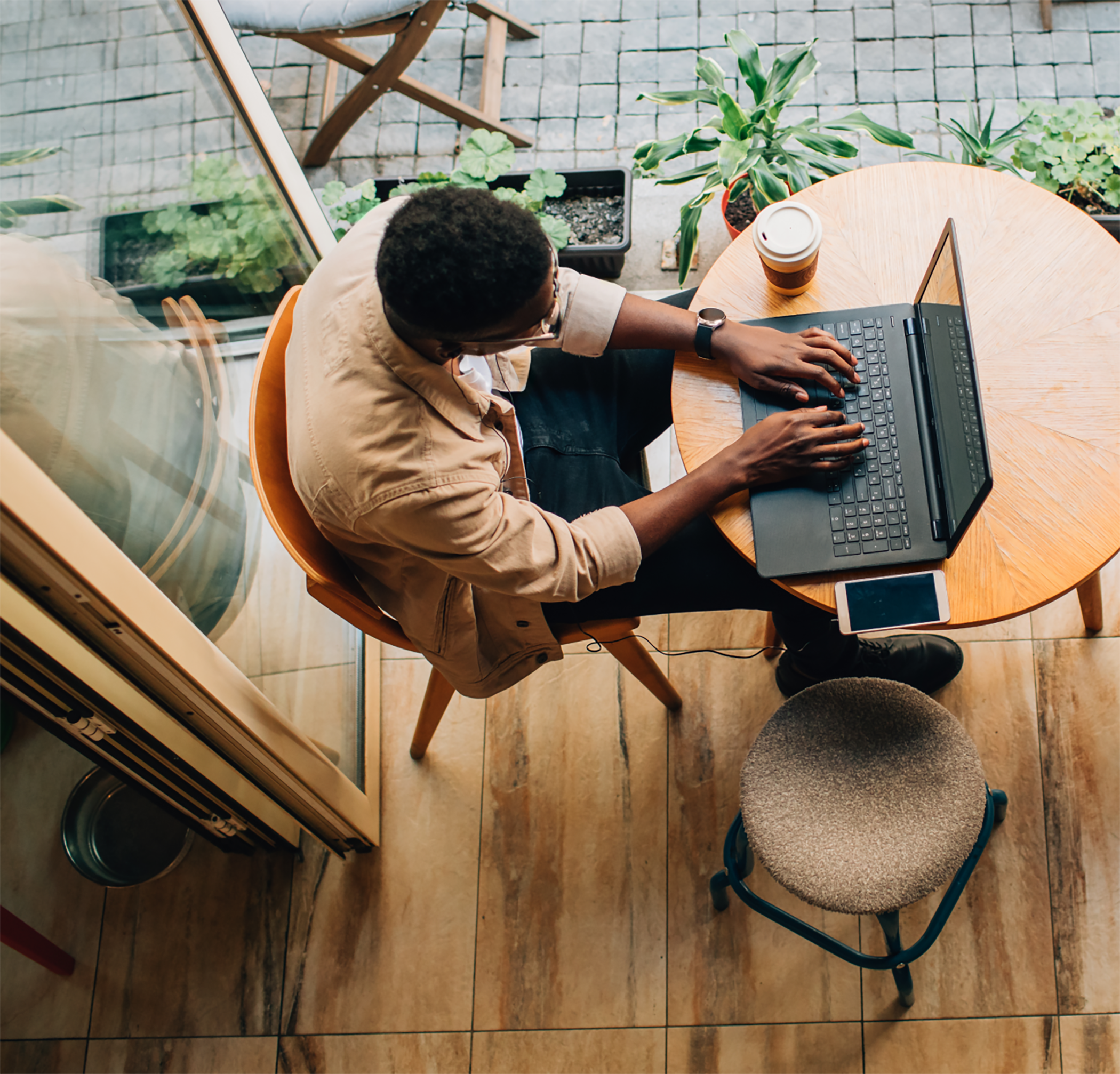Man working remote on laptop at table
