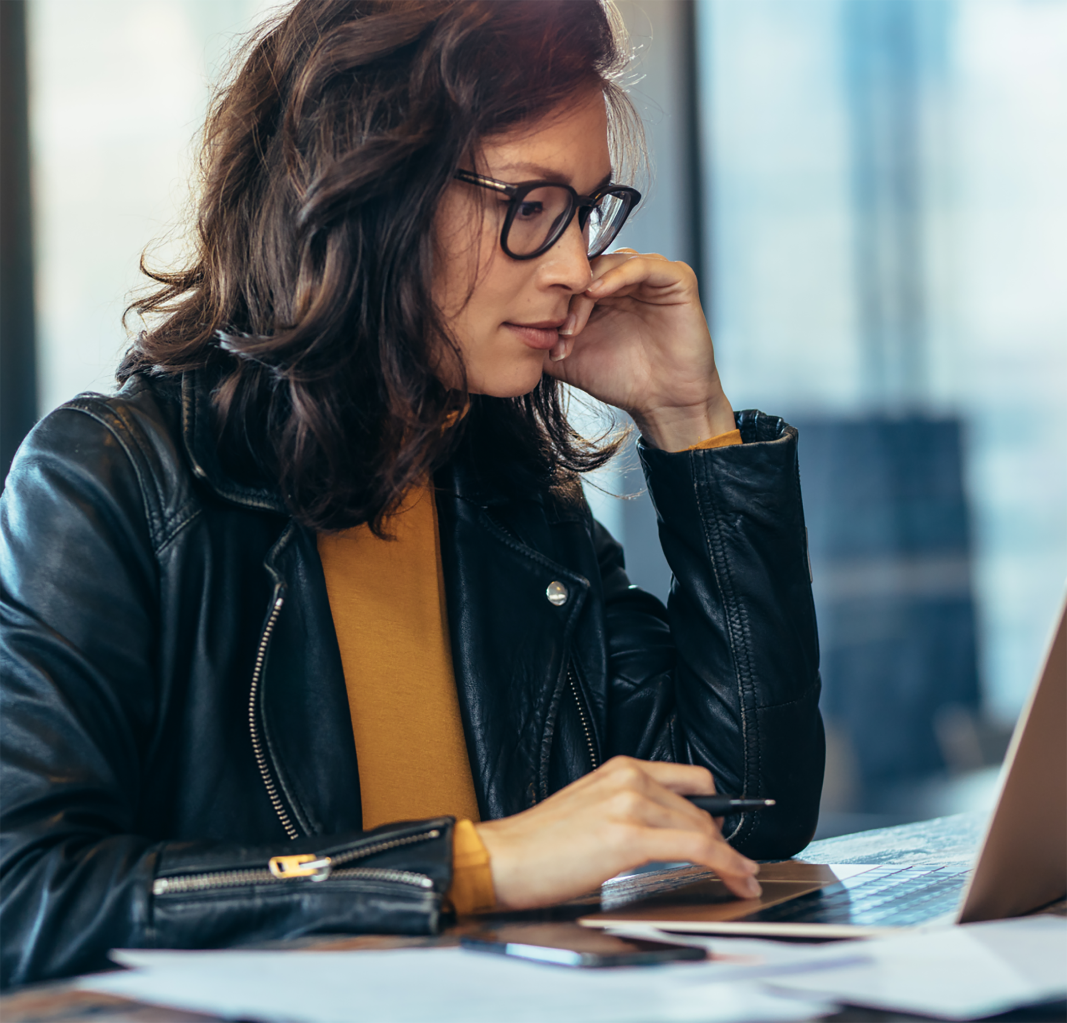 Woman using computer sitting at table