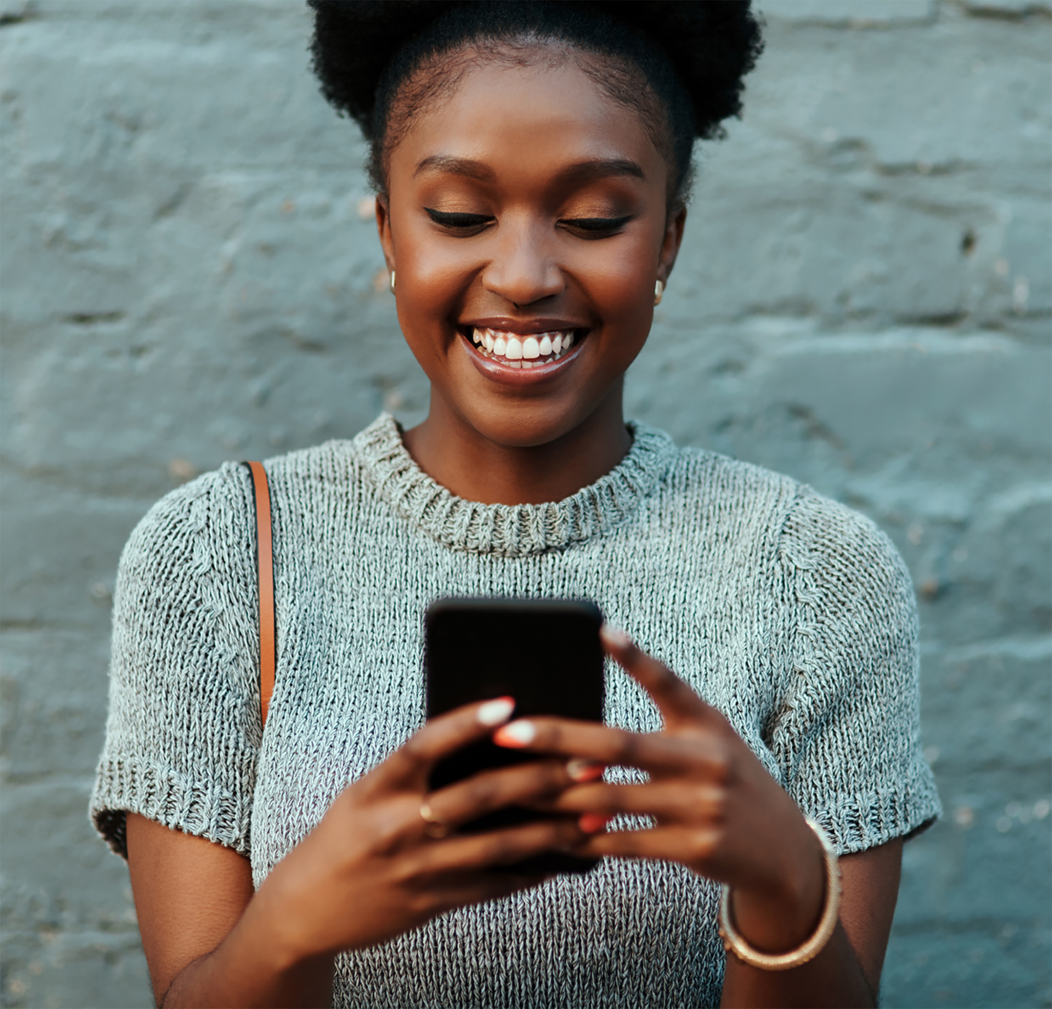 Woman using phone outside standing