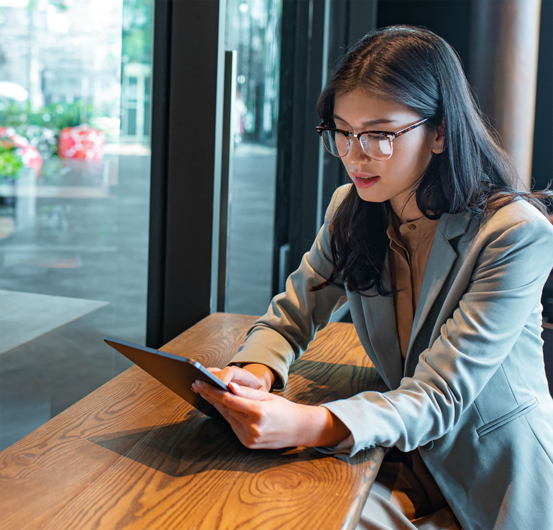Woman working remote on tablet