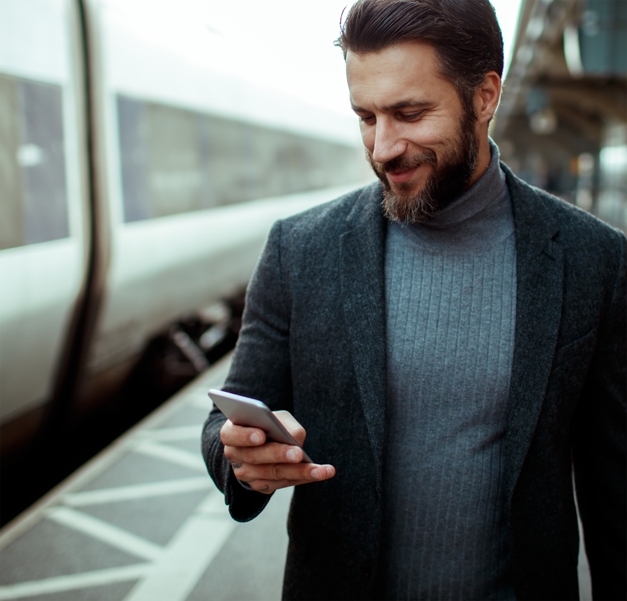 Man texting and walking outside