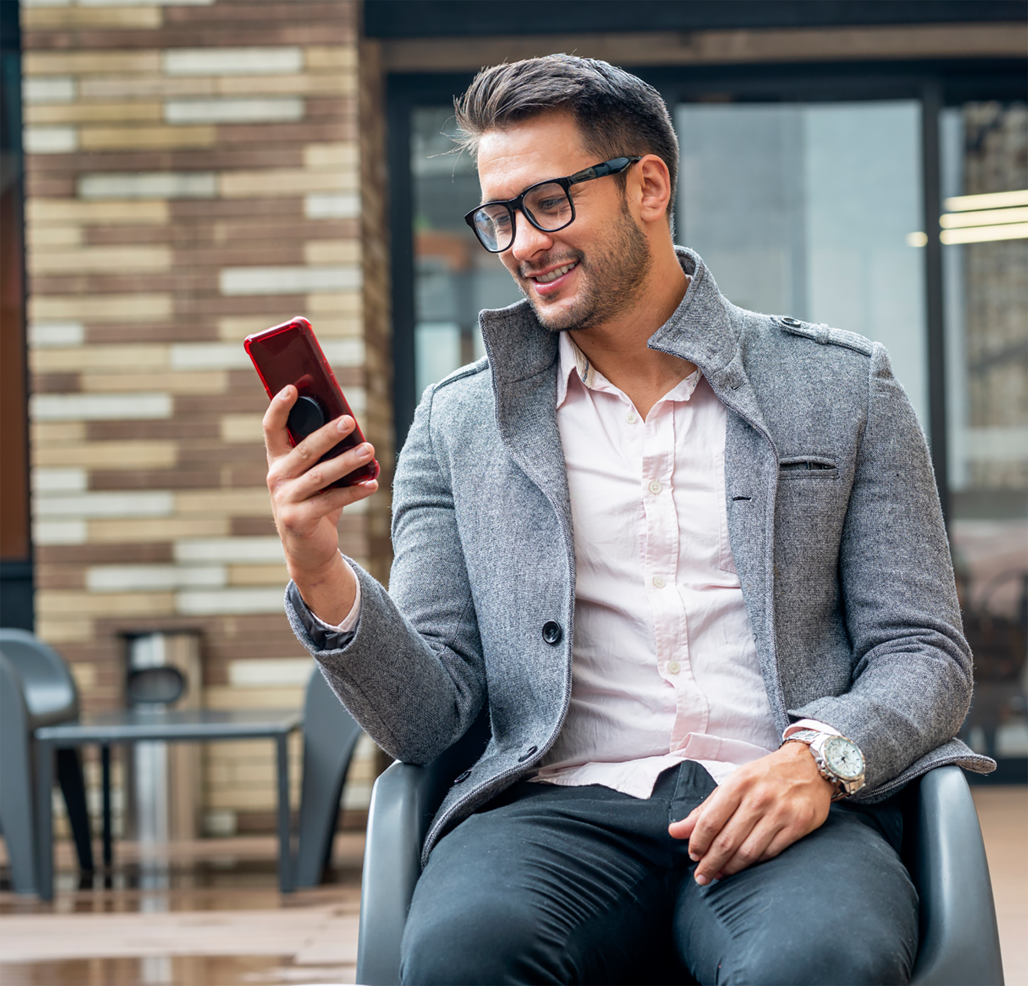 Man using phone outside sitting