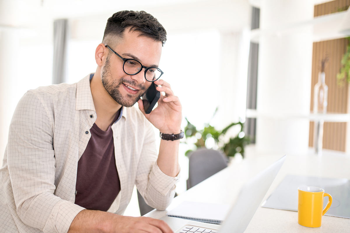 man interview phone laptop