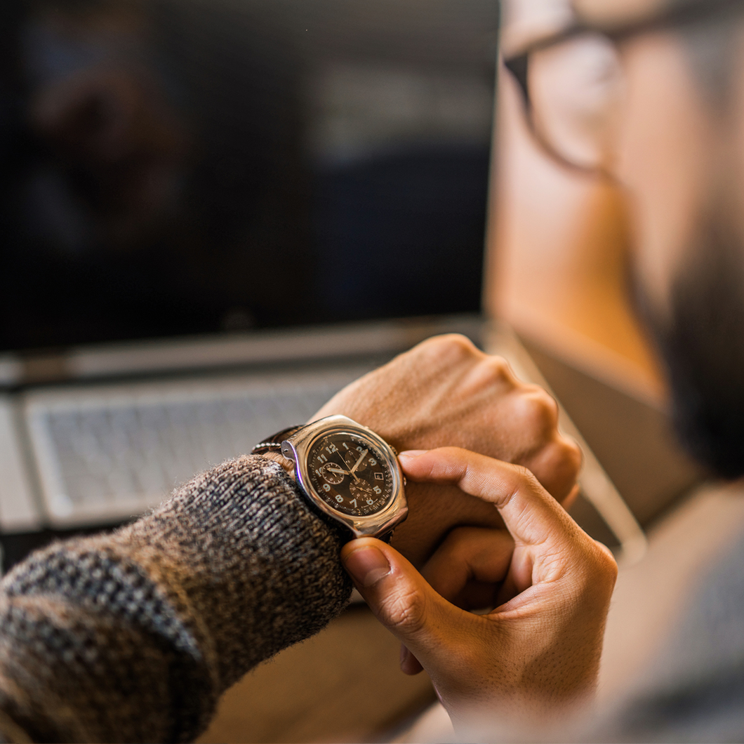 man looking watch feature