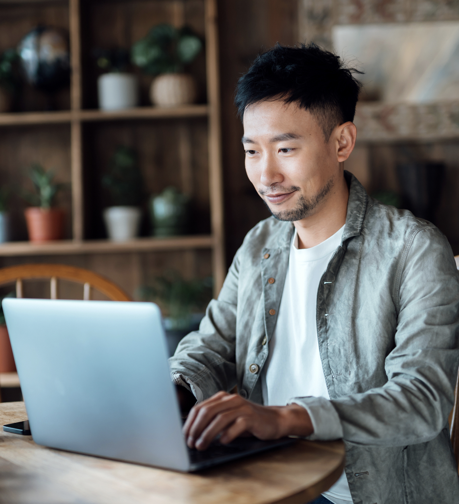 man on computer smiling