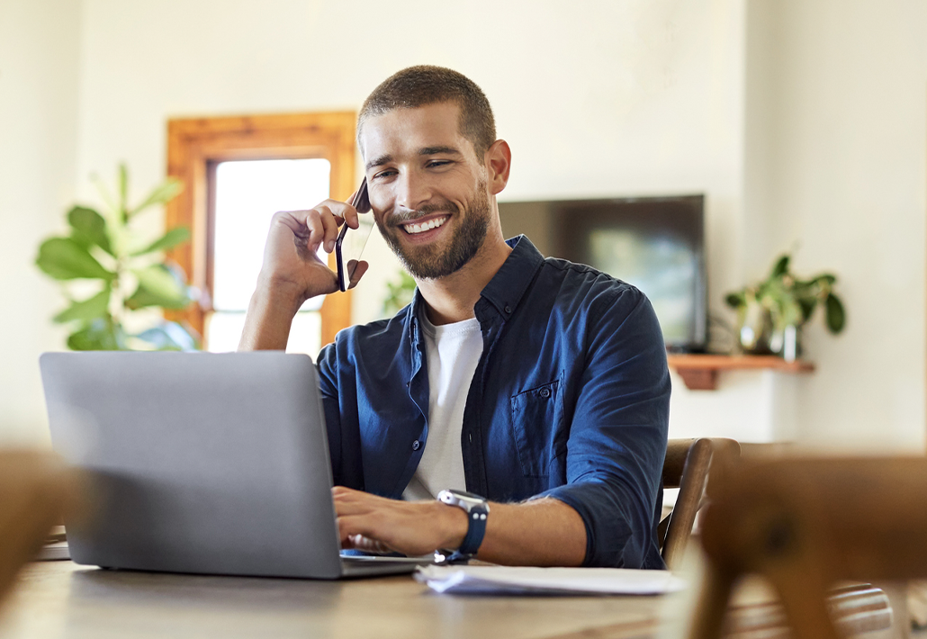 man working table on phone