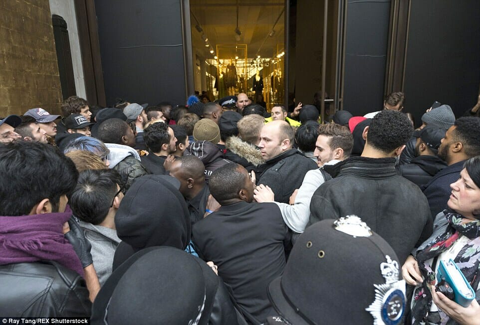 A crowded queue outside of an H&M store opening